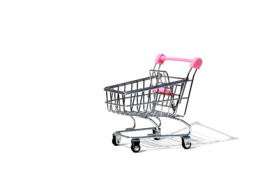 Empty shopping miniature cart isolated on white background