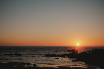 Poster - Mesmerizing shot of the tranquil beach during sunset