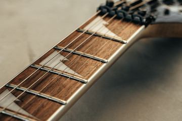 Guitar fingerboard with strings close up photo