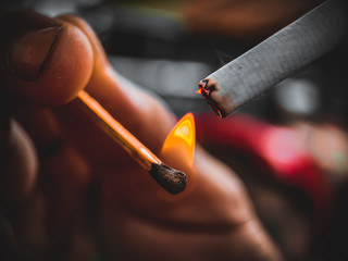 smoking cigarette with smoke in hand