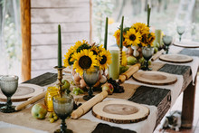 Decorated Table For A Rural Themed Party With Sunflowers And Fruits.