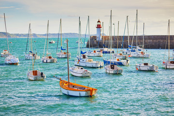 Canvas Print - Yachts and lighthouse in harbor of Erquy, Brittany, France