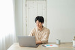 © One - One man working remotely and a cat.