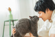 © One - One man working remotely and a cat.