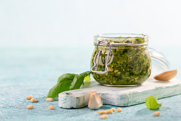 Wall Mural - Homemade pesto sauce with fresh basil.