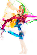 Splash Of Red Blue Green And Yellow Paint On Woman On White Background