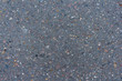 Asphalt texture background with the addition of little stones. Abstract background. Copy space for your text and decorations.