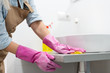 © Angelov - Housework and domestic lifestyle: woman doing chores in bathroom at home, cleaning wash basin and tap with spray detergent