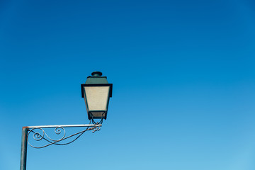 Poster - Low angle shot of a street lamp under a blue sky in Constancia, Santarem, Portugal