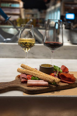 Sticker - Vertical shot of appetizers with glasses of red and white wine