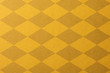 黄色いチェッカー模様のクラフトペーパーの背景テクスチャー