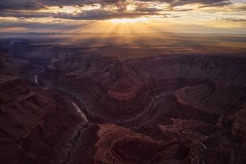 Wall Mural - Breathtaking aerial view of the Grand Canyon and Colorado River at sunset