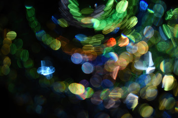 Sticker - Closeup shot of colorful bokeh lights with a dark background