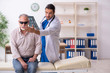 © Elnur - Old blind man visiting young male doctor