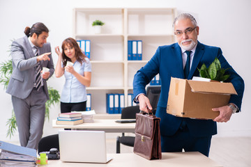 Two male and one female employees working in the office