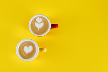 Wall Mural - Top view image of coffee cup on yellow background. Flat lay. Copy space