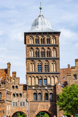 Sticker - historic red brick buildings and city gate guard tower in the old town of Lubeck