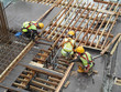 
KUALA LUMPUR, MALAYSIA -MARCH 05, 2020: Construction workers installing & fabricating timber formwork at the construction site. The formworks made from timber and plywood. 