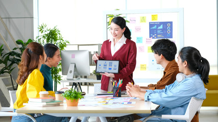 Wall Mural - brainstorm planing creative asian teamwork, group of asia mobile phone app developer team meeting fo