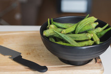 Closeup Shot Of A Bowl Of Okra And A Knife