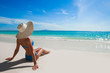© yellowj - Woman on beach looking at sea
