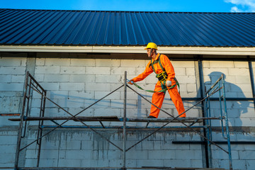 Poster - Construction workers wearing safety line during working at construction site.