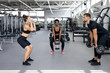 © alfa27 - sportive people, multiethnic group perform exercises with heavy weights in gym. young diverse man and women workout, have muscular body