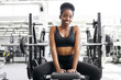 © alfa27 - portrait of adorable african lady sitting in gym, young lady in sportswear after crossfit exercises, posing, smile. healthy lifestyle concept