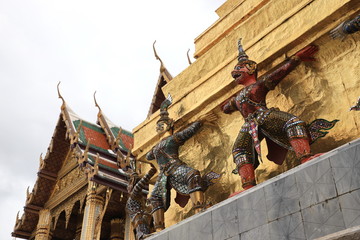 Wall Mural - Bangkok 4 August 2020: colorful giants and monkeys Carrying the golden pagoda are unique work of art in the Grand Palace or Wat Phra Kaew. Best Place to Visit in Bangkok, Thailand.