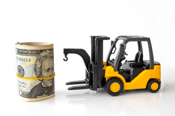 Mini forklift truck load stack of banknotes usa. Logistics, transportation, management ideas, Industry business commercial concept.