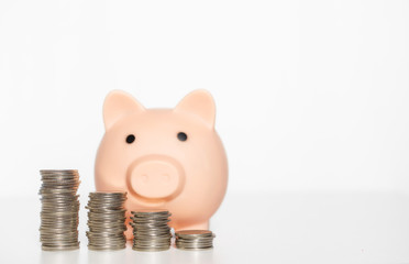 money saving concept coin row stack and piggy bank on white background. financial business and investment.