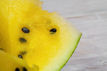 a piece of yellow watermelon