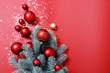 © Larysa - Christmas background in red and green. Nobody. Decorative composition: Christmas tree, large, small balls of red and gold, artificial snow. Top view. Horizontal, Place for text. Happy New Year theme.