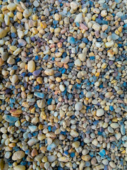 Canvas Print - Vertical high angle shot of colorful small pebbles