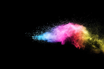 Wall Mural - explosion of colored powder isolated on black background.