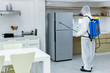 © Pornsak - Male medical staff wearing PPE suits to protect against COVID-19 using nebulizers. And use chemicals disinfecting in kitchens.