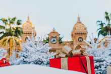 Monte Carlo Casino In Monaco, 25.12.2019 Cote De Azur, Europe. View Of Grand Theatre, Office Of Les Ballets De Monte Carlo In Winter. White Christmas Tree, Red Gift Boxes And New Year Decorations.