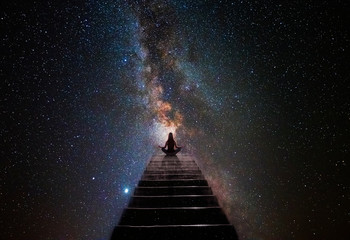 woman in yoga pose at top of stair