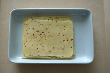 Sticker - High angle shot of cheese slices in a white bowl