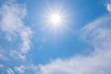 beautiful shining sun at clear blue sky.