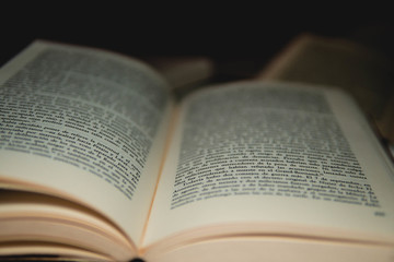 Poster - Closeup of the pages of an opened aged vintage book