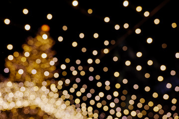 Wall Mural - Defocused and night vibrance atmosphere of Weihnachtsmarkt, annual Christmas market, with circle Bokeh from decorated light bulbs.