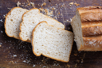 Wall Mural - sliced bread on a wooden board