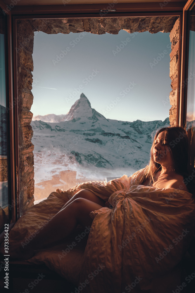 Woman tourist selfie near the Matterhorn mountain.Famous popular touristic place in the world. - obrazy, fototapety, plakaty 