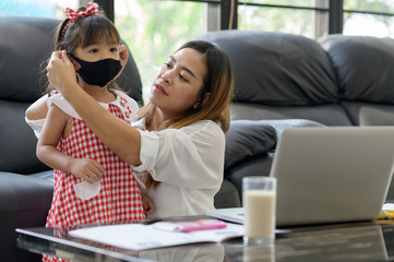 people person family concept.Mother wears a mask to her child.Protect your loved ones