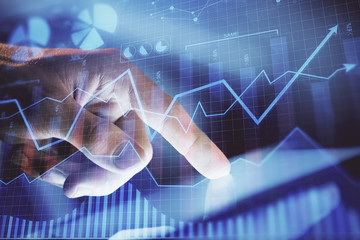 Multi exposure of man's hands holding and using a phone and financial chart drawing. Market analysis concept.