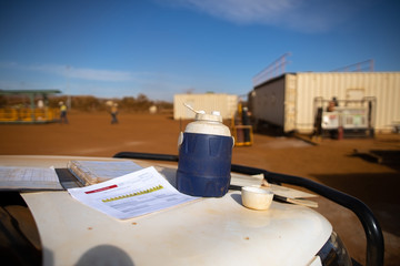 Wall Mural - safe workplaces jsa risk assessment document booklet working at heights permit placing front of ute 