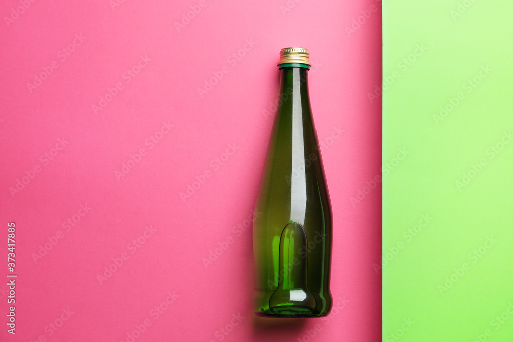 Bottle of clean water on color background