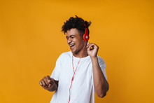 Image Of Excited African American Guy Listening Music With Headphones