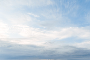 Wall Mural - blue sky with white clouds. background from the cloudy sky. long and stretched clouds in the sky.blu